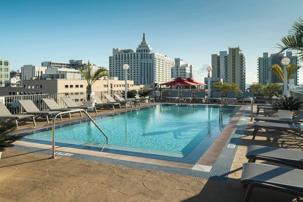 Outdoor pool, open 8:00 AM to 10:00 PM, pool loungers