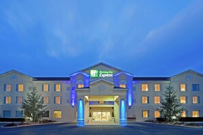 A Holiday Inn Express building with a symmetrical facade, multiple windows, and a central entrance.