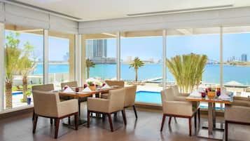 Breakfast, lunch, dinner served; international cuisine, pool views