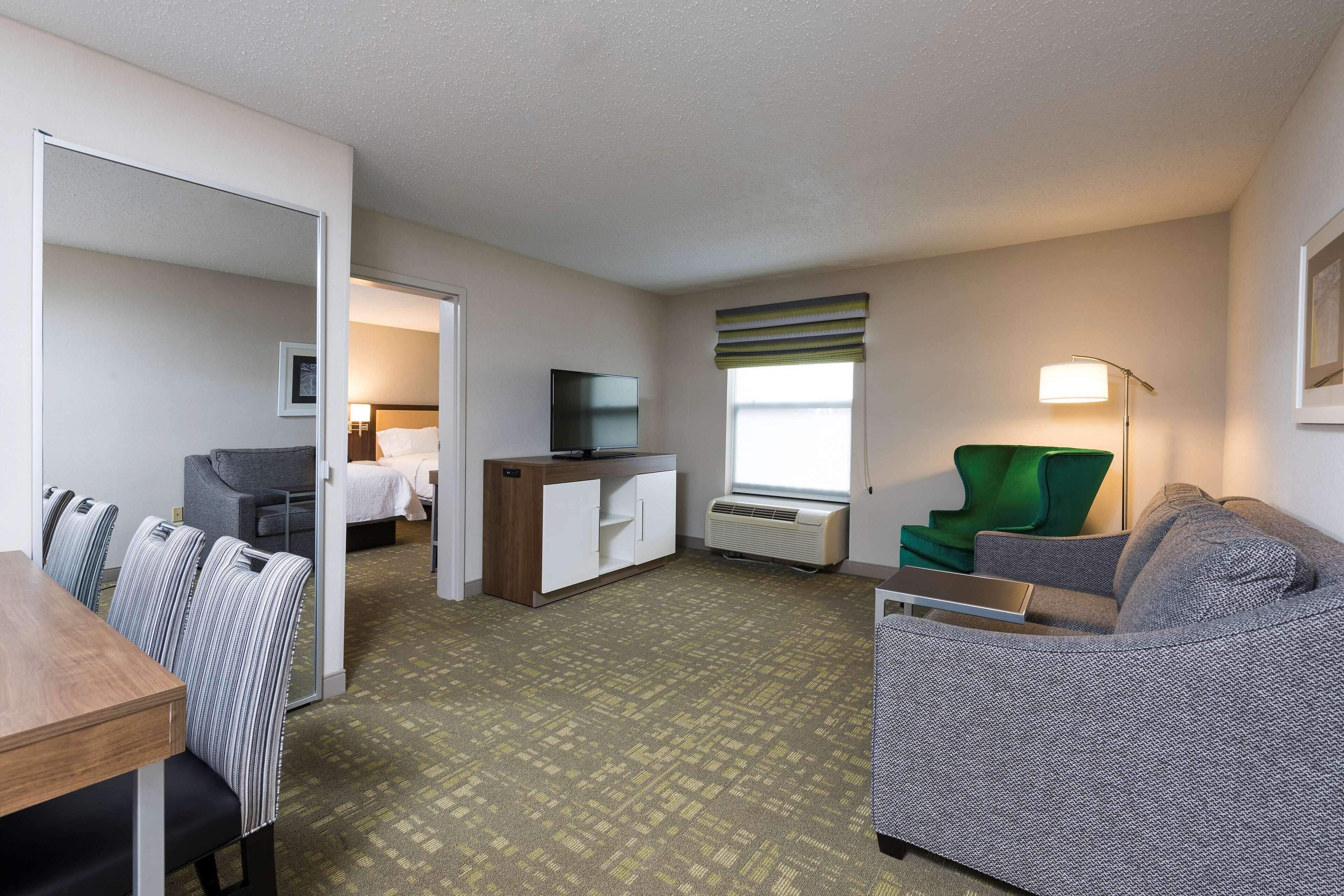 suite, 2 queen beds, refrigerator & microwave (wet bar) | in-room safe, laptop workspace, iron/ironing board, free wifi