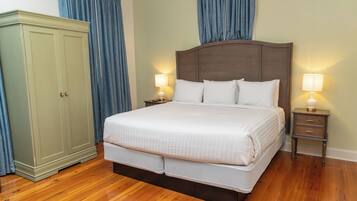 Deluxe Room, 1 King Bed | Living area | Flat-screen TV, MP3 dock