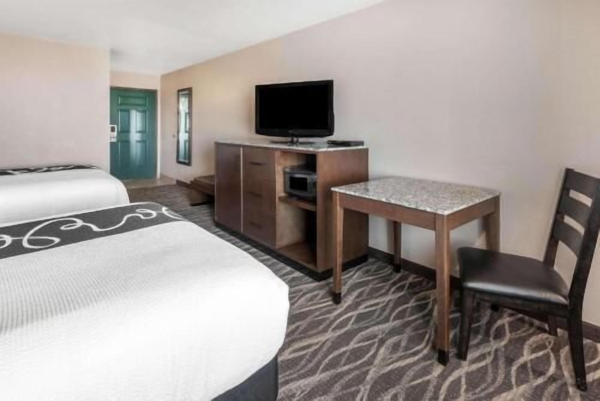 Premium bedding, pillow-top beds, desk, blackout curtains
