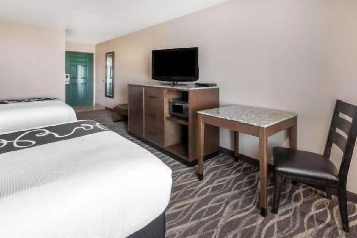 Premium bedding, pillow-top beds, desk, blackout curtains