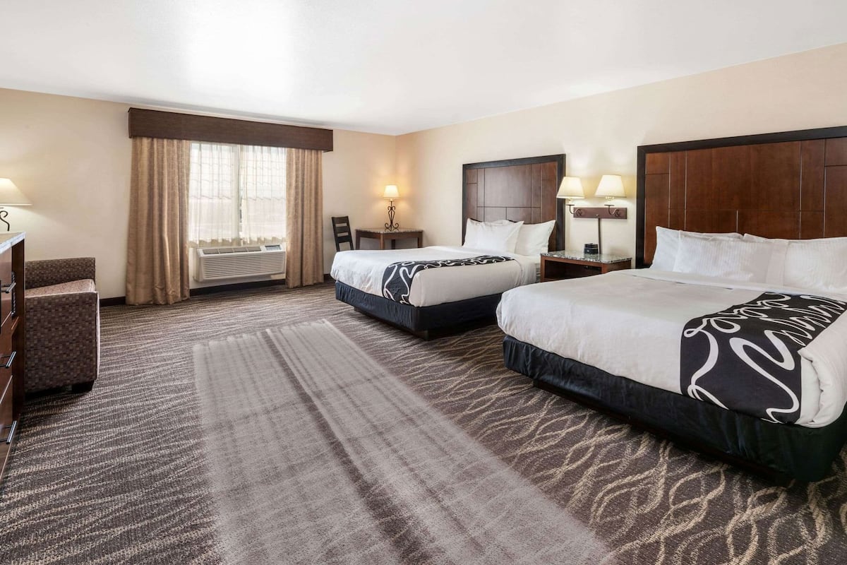 Premium bedding, pillow-top beds, desk, blackout curtains