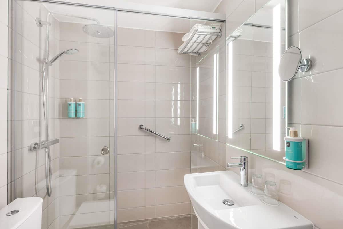 designer toiletries, hair dryer, towels, soap