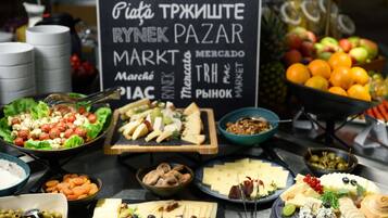 A variety of food items and a sign with multiple language translations.