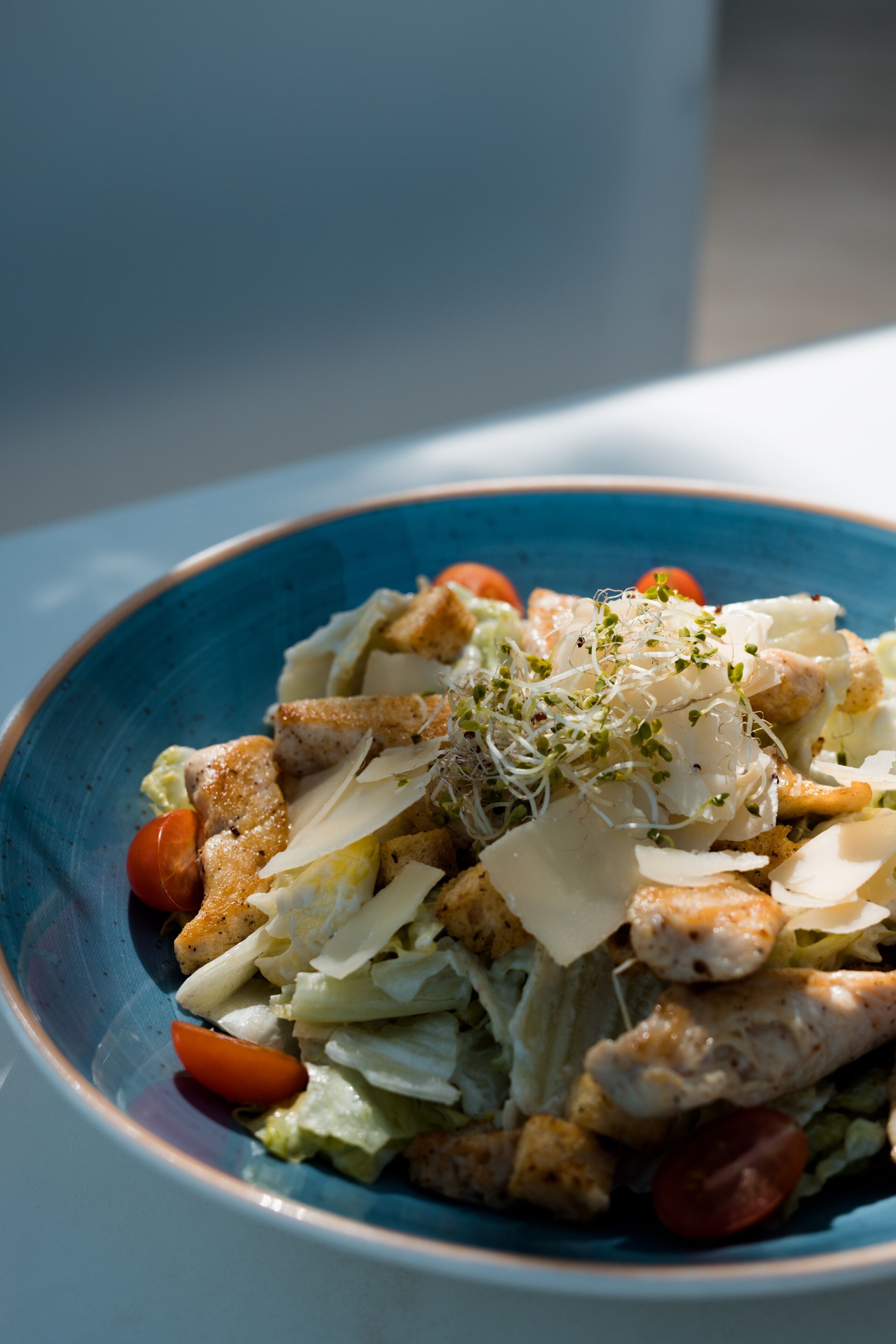 A bowl of salad with various ingredients.
