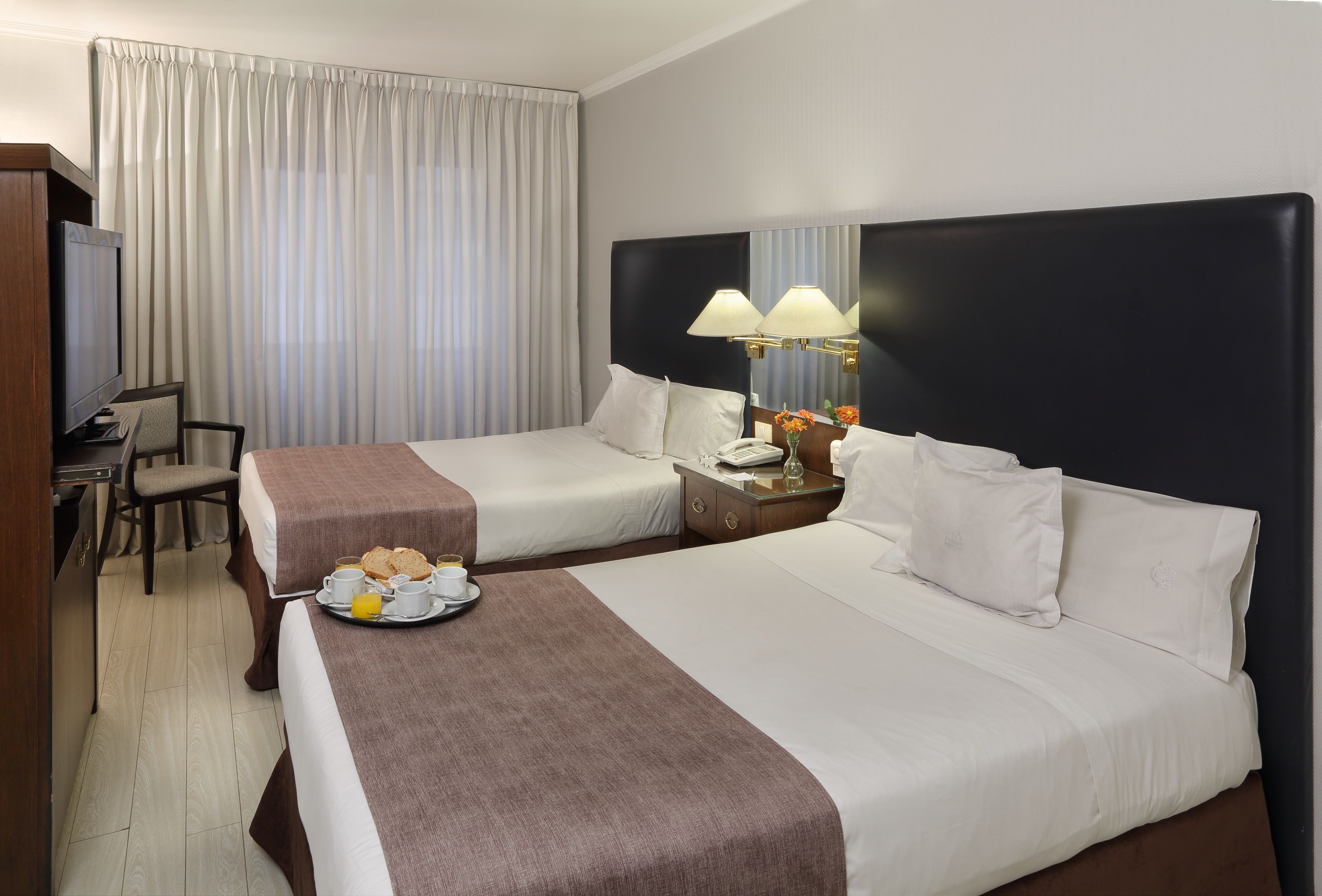 standard room, 2 double beds | minibar, in-room safe, desk, iron/ironing board