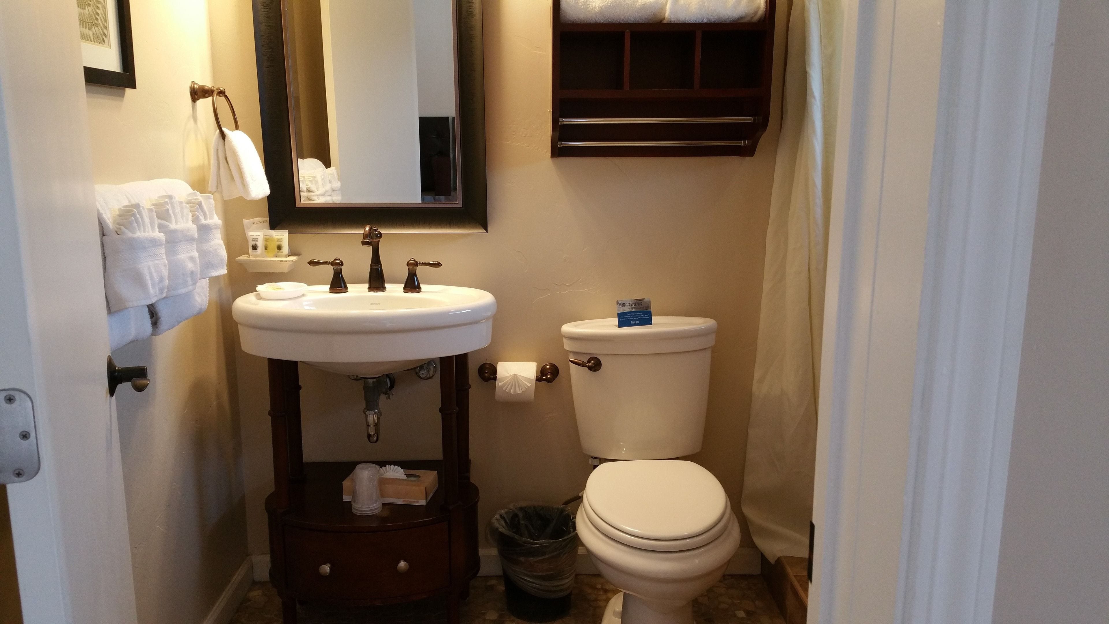 designer toiletries, hair dryer, towels