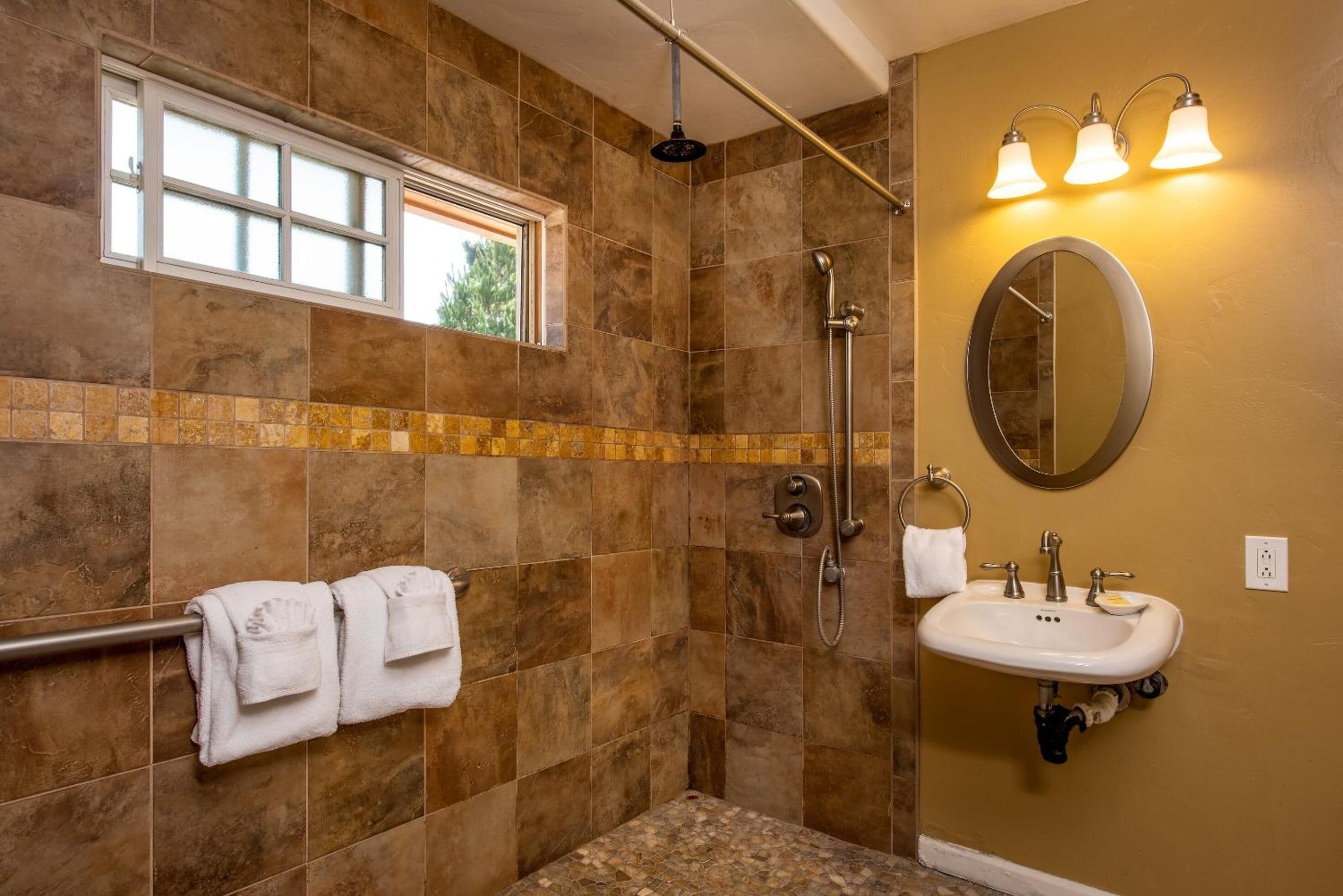 deluxe room, 1 king bed, fireplace | bathroom | designer toiletries, hair dryer, towels