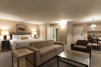 In-room safe, desk, laptop workspace, blackout drapes at Tuscany Suites & Casino
