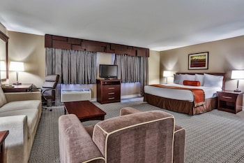 In-room safe, desk, laptop workspace, blackout drapes at Tuscany Suites & Casino