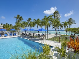 Outdoor pool, open 7:00 AM to 7:00 PM, pool umbrellas, sun loungers