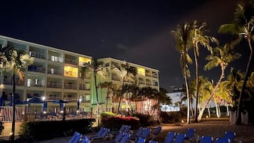 On the beach, white sand, sun loungers, beach towels