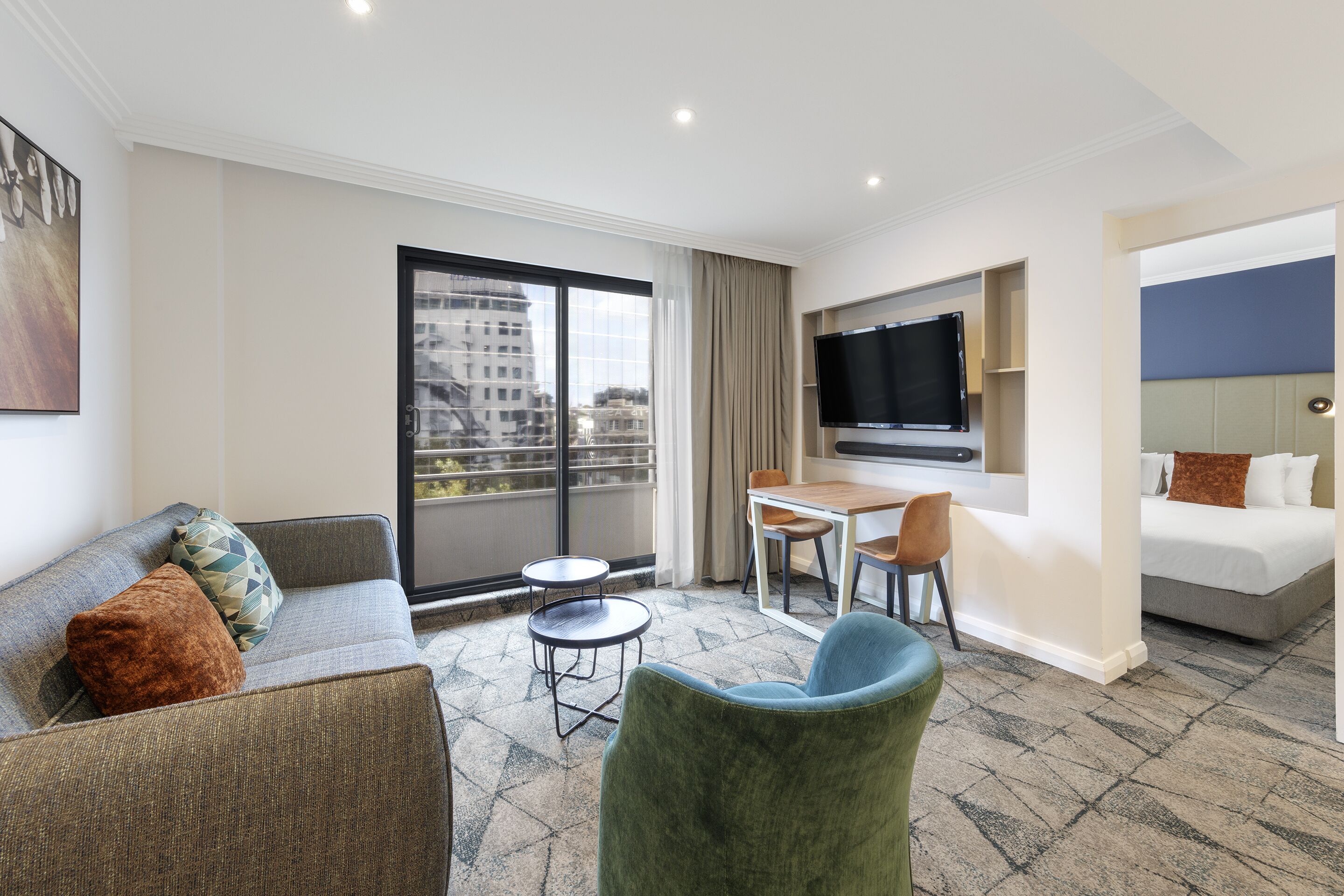 deluxe room, 1 bedroom | living area | lcd tv, dvd player, pay films