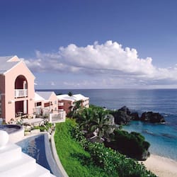 On the beach, white sand, sun loungers, beach umbrellas