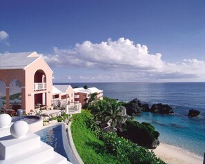 On the beach, white sand, sun-loungers, beach umbrellas