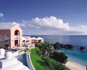 On the beach, white sand, sun loungers, beach umbrellas