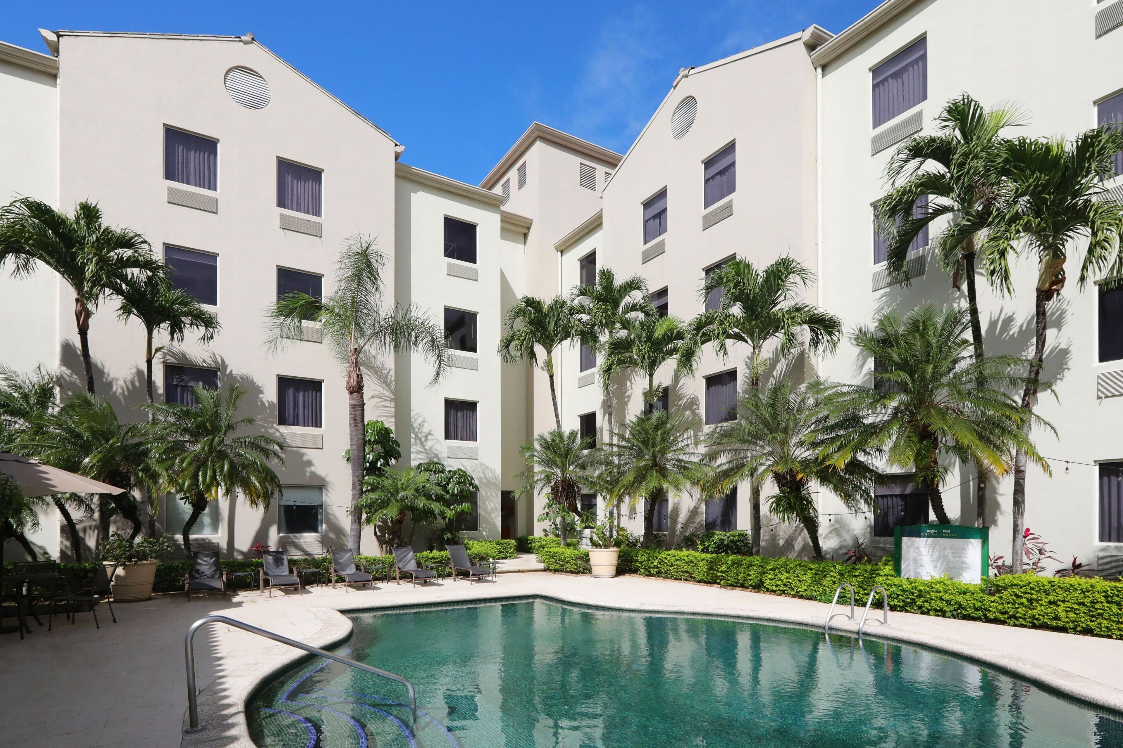 outdoor pool, pool umbrellas, pool loungers