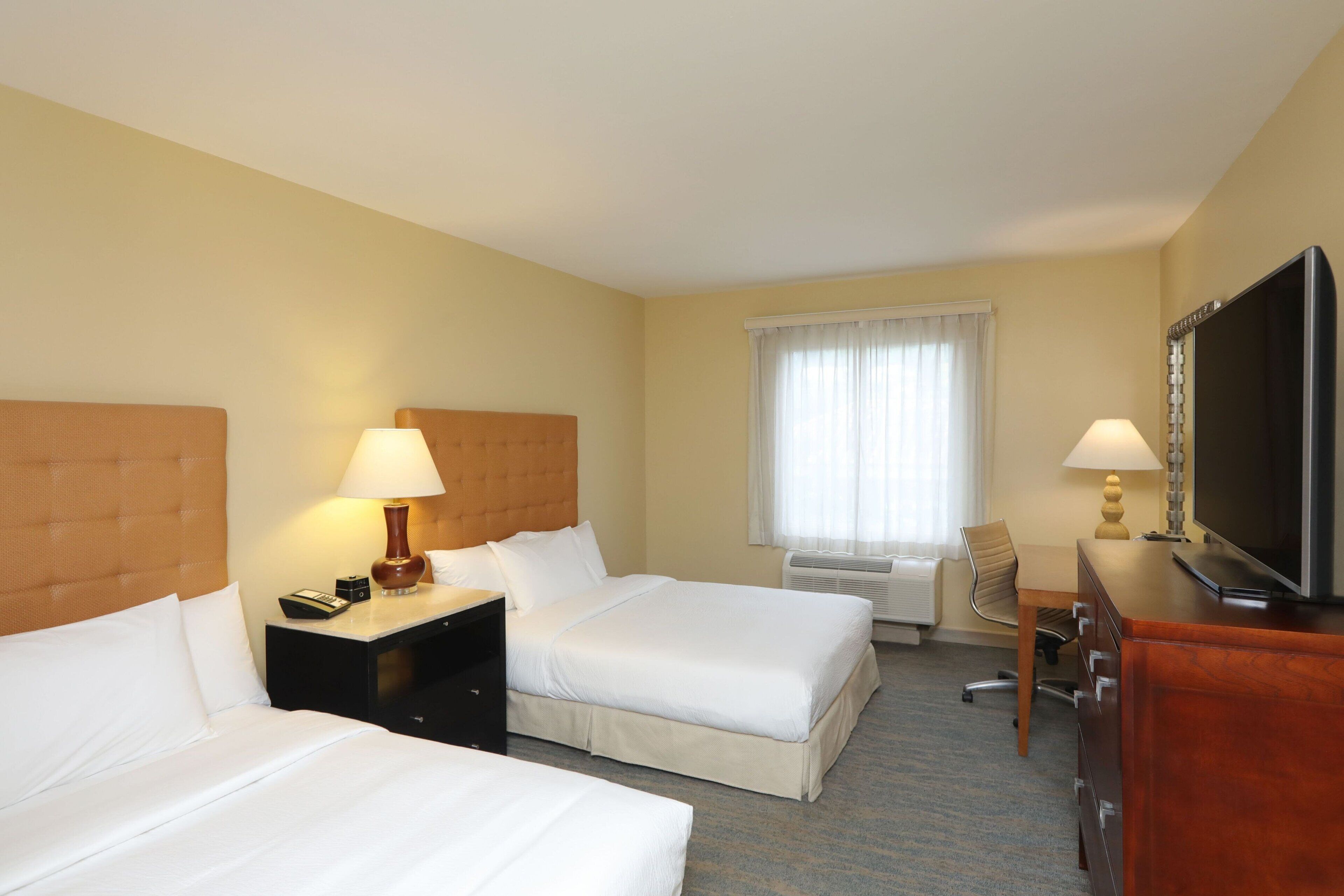 traditional room, 2 double beds | premium bedding, pillow-top beds, in-room safe, desk