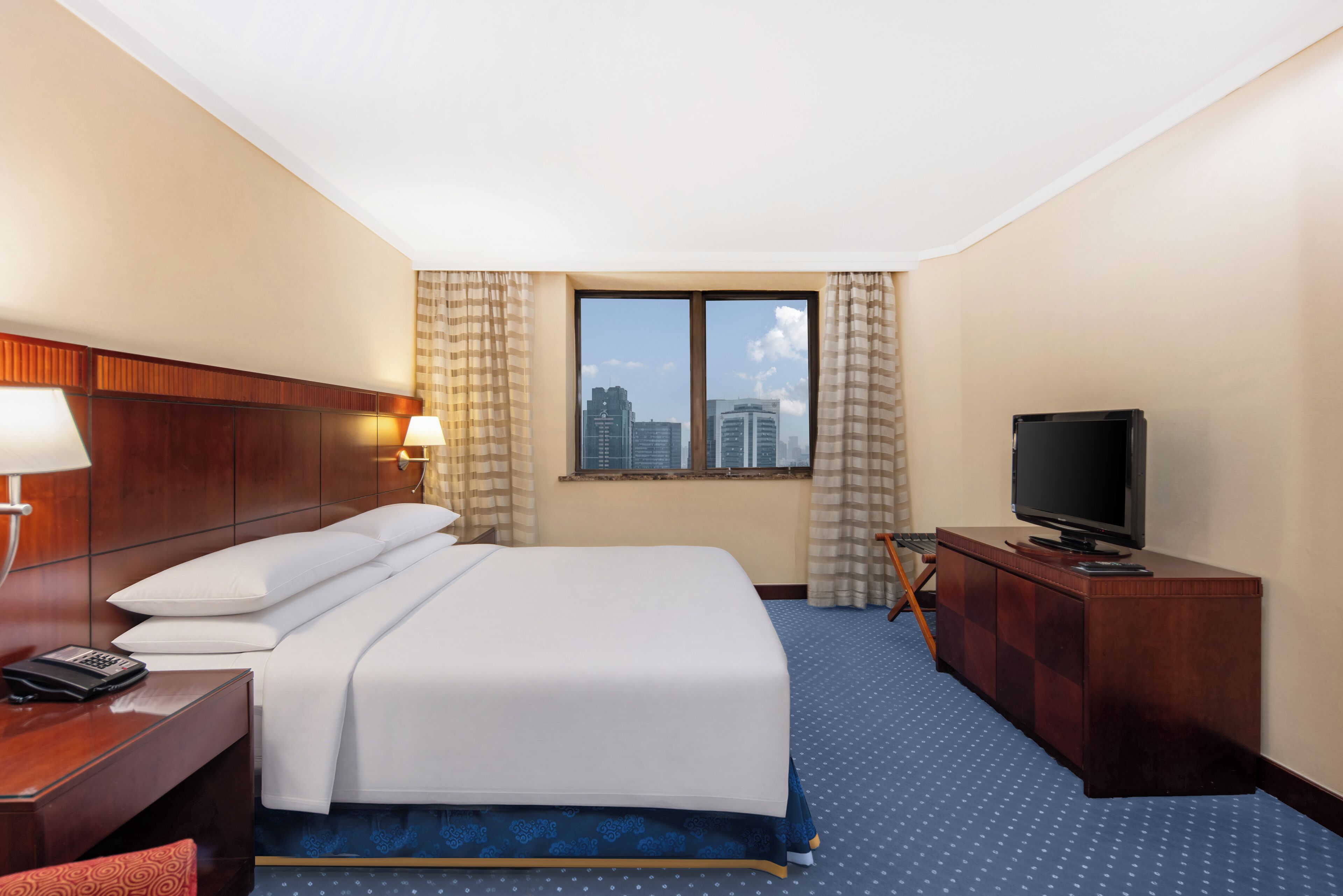 Basic Suite, City View | Down comforters, minibar, in-room safe, desk