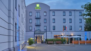 A Holiday Inn Express building with a modern design, featuring a curved facade, multiple windows, and a prominent entrance. - Holiday Inn Express Dortmund by IHG (Dortmund)