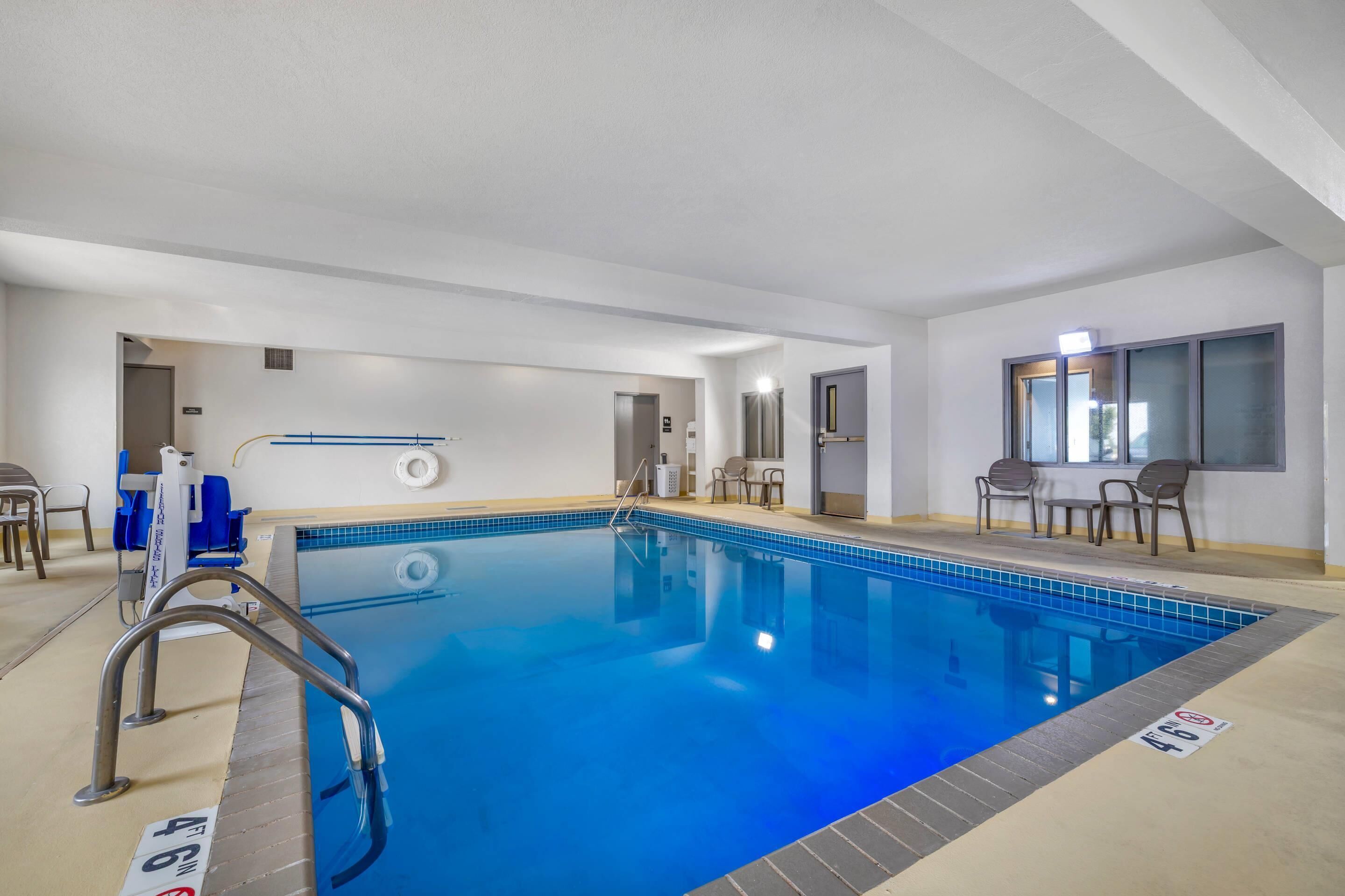 Indoor pool, open 7:00 AM to 11:00 PM, pool loungers