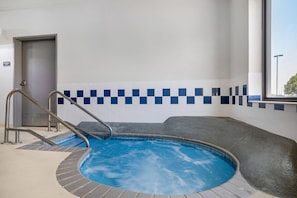 An indoor swimming pool with a checkered tile wall, a door labeled 'Mechanical Room,' and a window with a view outside. - Comfort Inn & Suites Rochester South Mayo Clinic (Rochester)