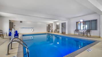 Indoor pool, open 7:00 AM to 11:00 PM, pool loungers