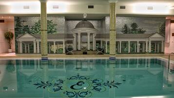 Indoor pool, open 7:00 AM to 7:00 PM, pool loungers