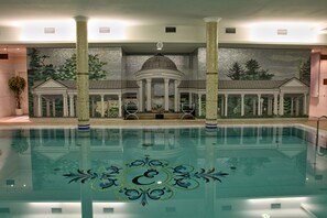 Indoor pool, open 7:00 AM to 7:00 PM, pool loungers