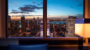 A cityscape view from a high-rise building at dusk. - W New York - Times Square (New York)