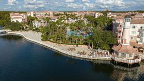 A resort with a waterfront, a pool, and a gazebo area.