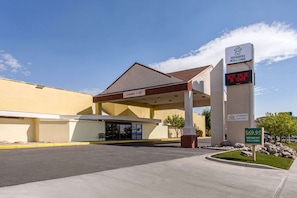 A commercial building with a sign indicating a clearance of 15 feet.