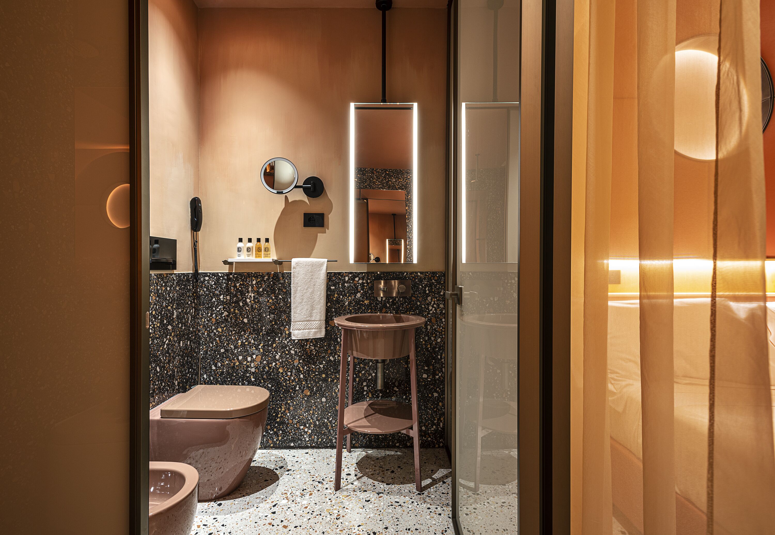 nesting private suite | bathroom | eco-friendly toiletries, hair dryer, slippers, bidet