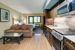 Studio Suite, 1 King Bed with Sofa bed, Balcony | Living area | 42-inch flat-screen TV with digital channels, TV, pay movies