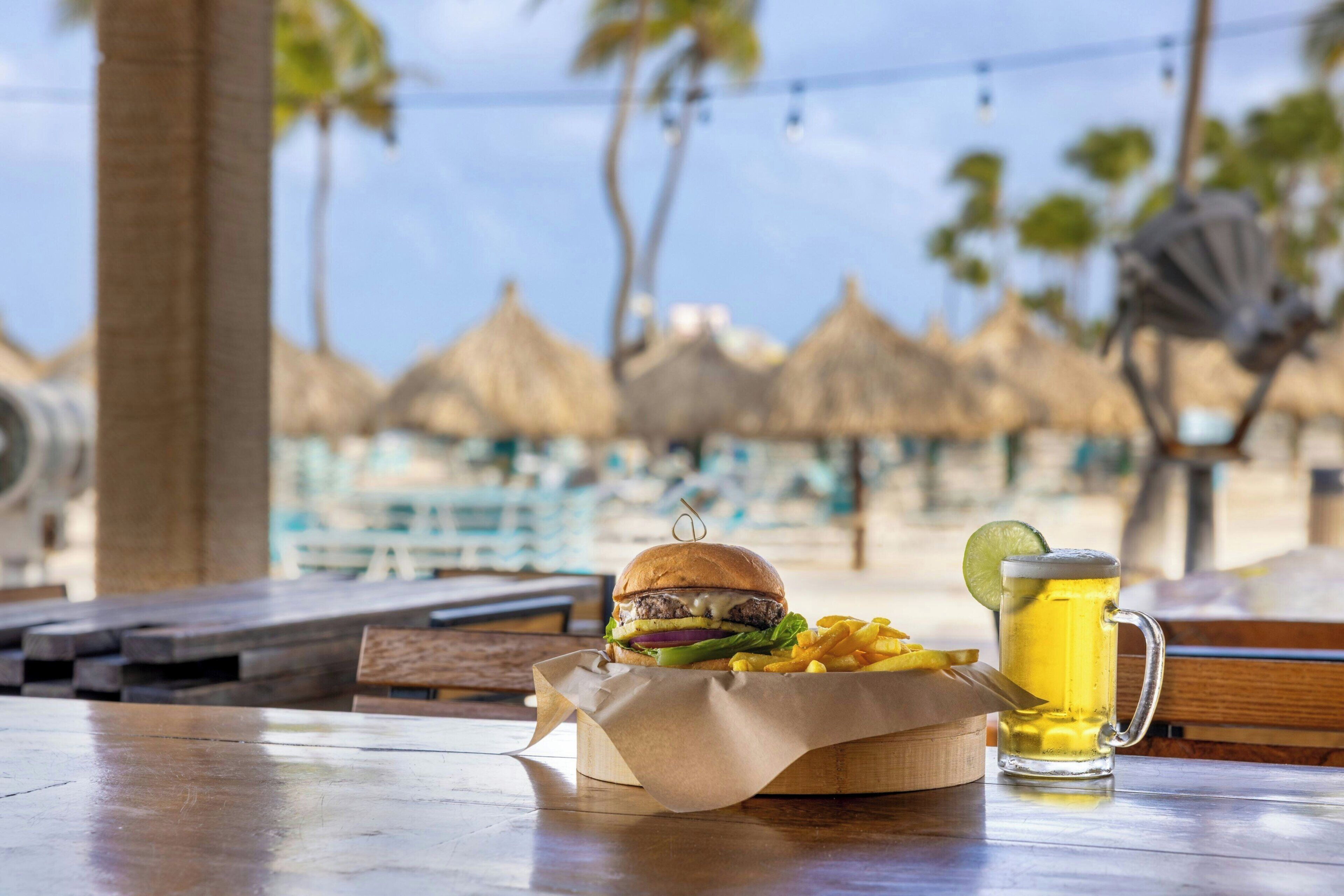 On the beach, white sand, beach cabanas, sun loungers