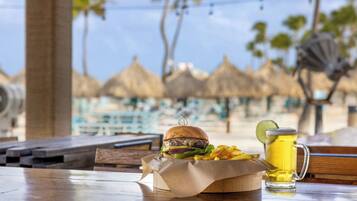 On the beach, white sand, beach cabanas, sun loungers