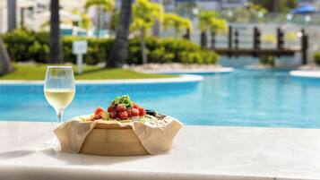 On the beach, white sand, beach cabanas, sun loungers
