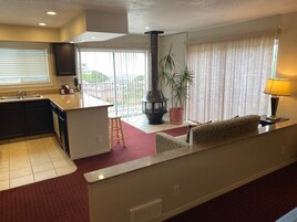 Suite, 1 King Bed | Living area | 50-inch flat-screen TV with cable channels, TV