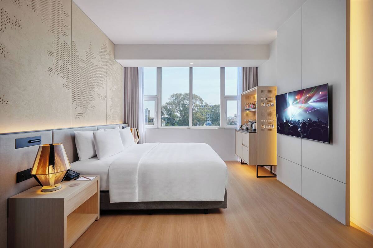 Deluxe Room with Balcony - Newly Renovated | Minibar, in-room safe, iron/ironing board, free WiFi