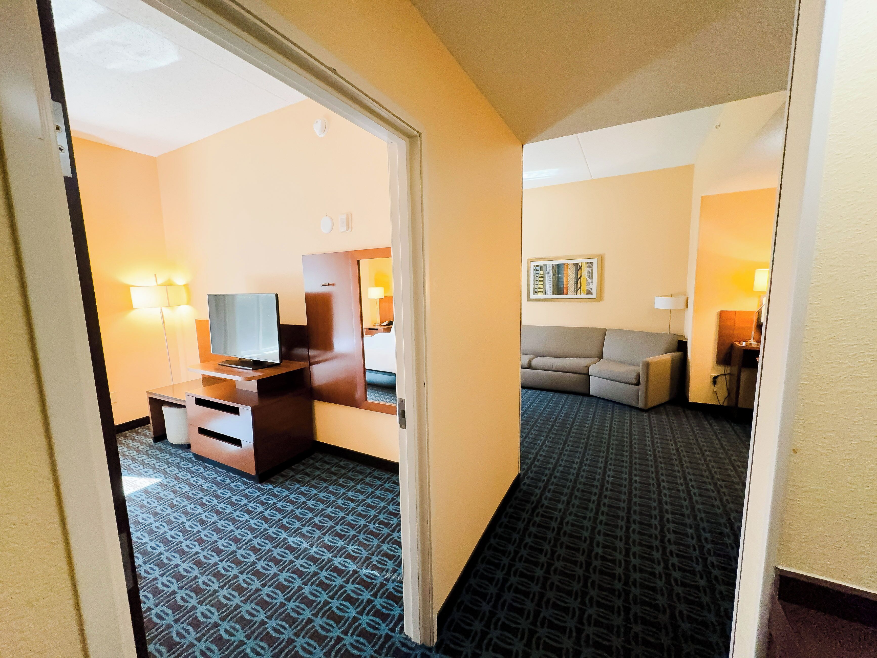 suite, 1 king bed with sofa bed, non smoking | in-room safe, desk, iron/ironing board, free rollaway beds