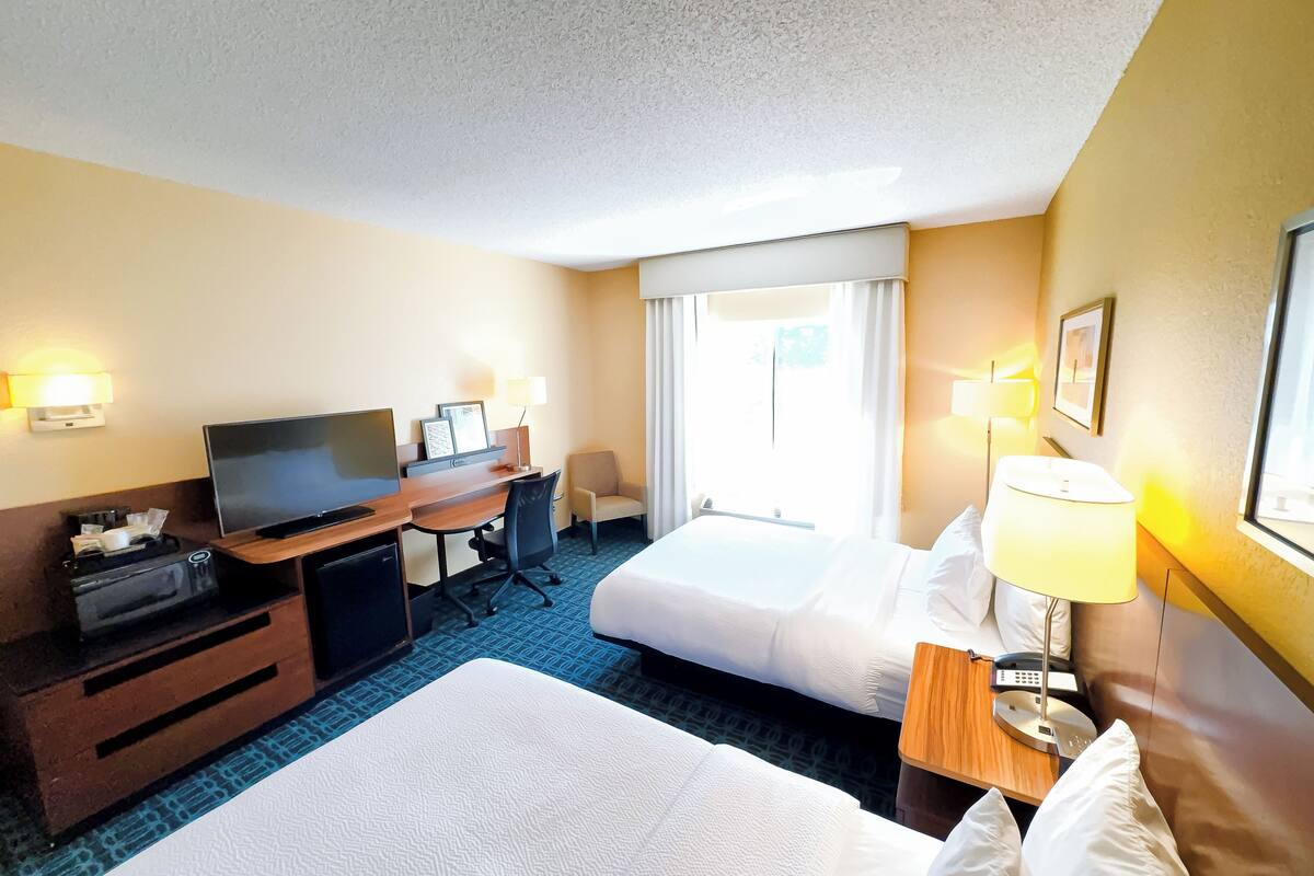 room, 2 double beds | in-room safe, desk, iron/ironing board, free rollaway beds