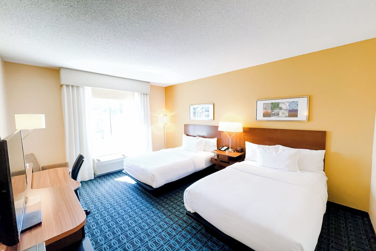 room, 2 double beds | in-room safe, desk, iron/ironing board, free rollaway beds