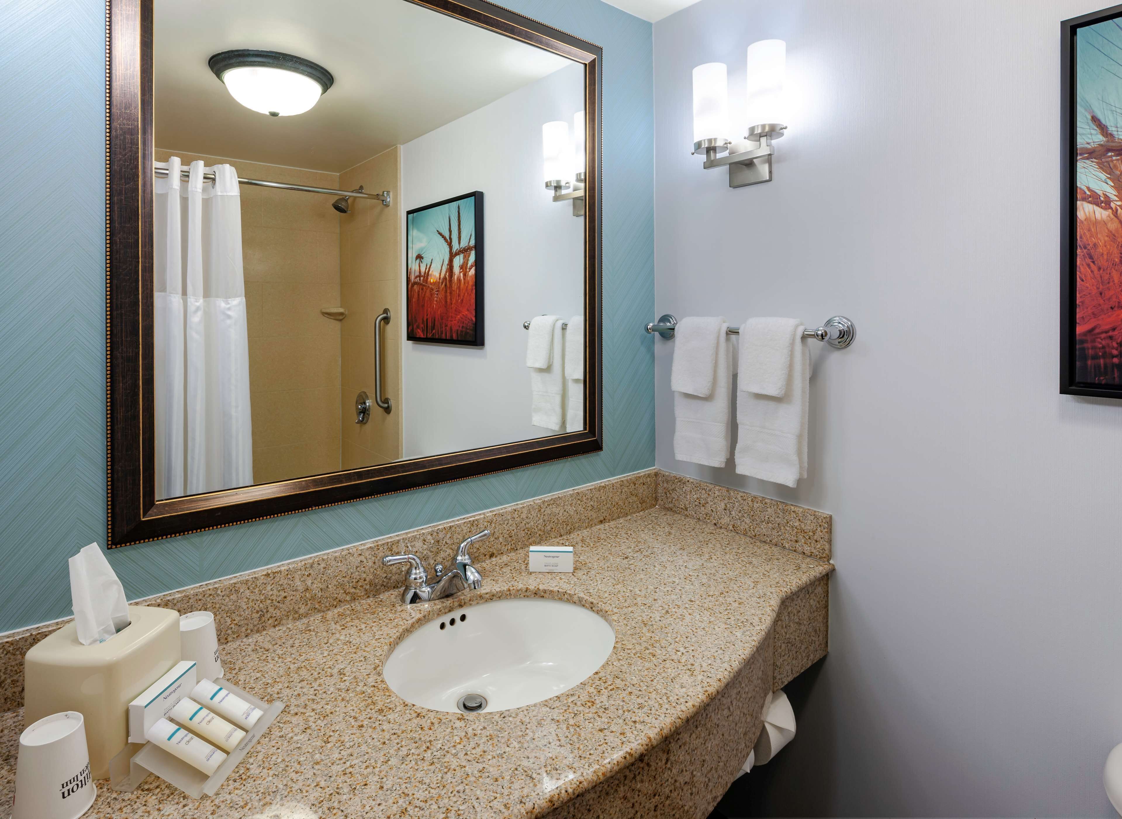 room, 2 queen beds | bathroom | combined shower/bathtub, hydromassage showerhead, free toiletries