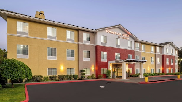 A multi-story hotel with a modern facade, featuring a prominent entrance with a covered walkway. - TownePlace Suites by Marriott San Pablo (San Pablo)