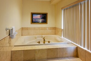 Suite, 1 King Bed, Jetted Tub (Master) | 1 bedroom, premium bedding, desk, blackout drapes