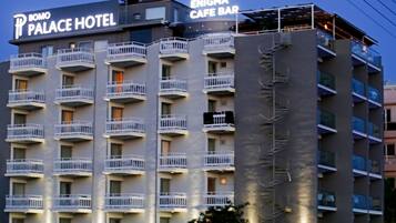 A multi-story hotel with balconies and a cafe bar on the top floor.