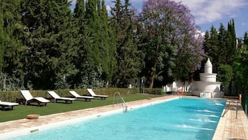 Seasonal outdoor pool, pool loungers