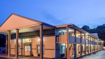 A motel with a two-story structure, a covered front area, and a sign indicating it is a Super 8.